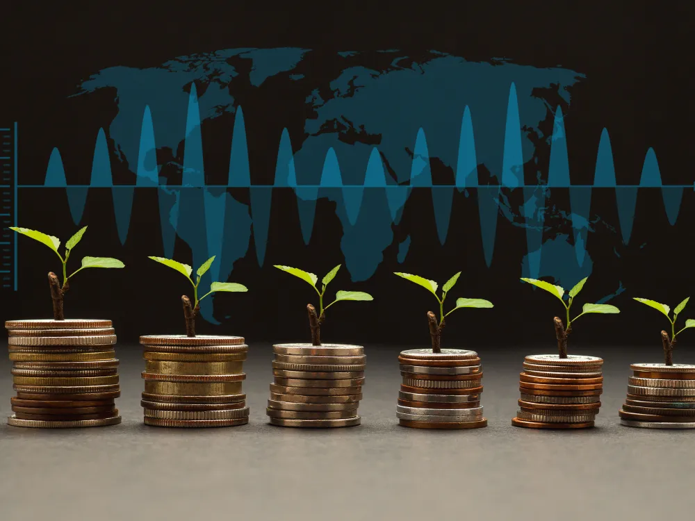 New plants sprout from stacks of coins against a world map and a fluctuating graph, symbolizing growth and investment.