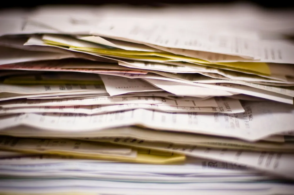 A heap of receipts and other accounting papers.