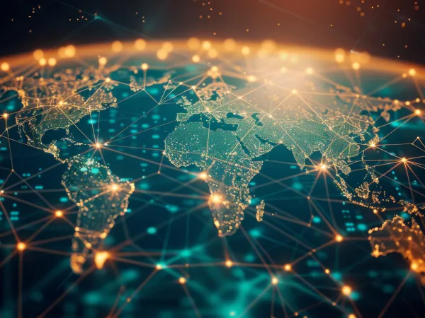 A glowing digital world map with illuminated network nodes and connecting lines spanning continents, symbolizing global data flow and information networks.